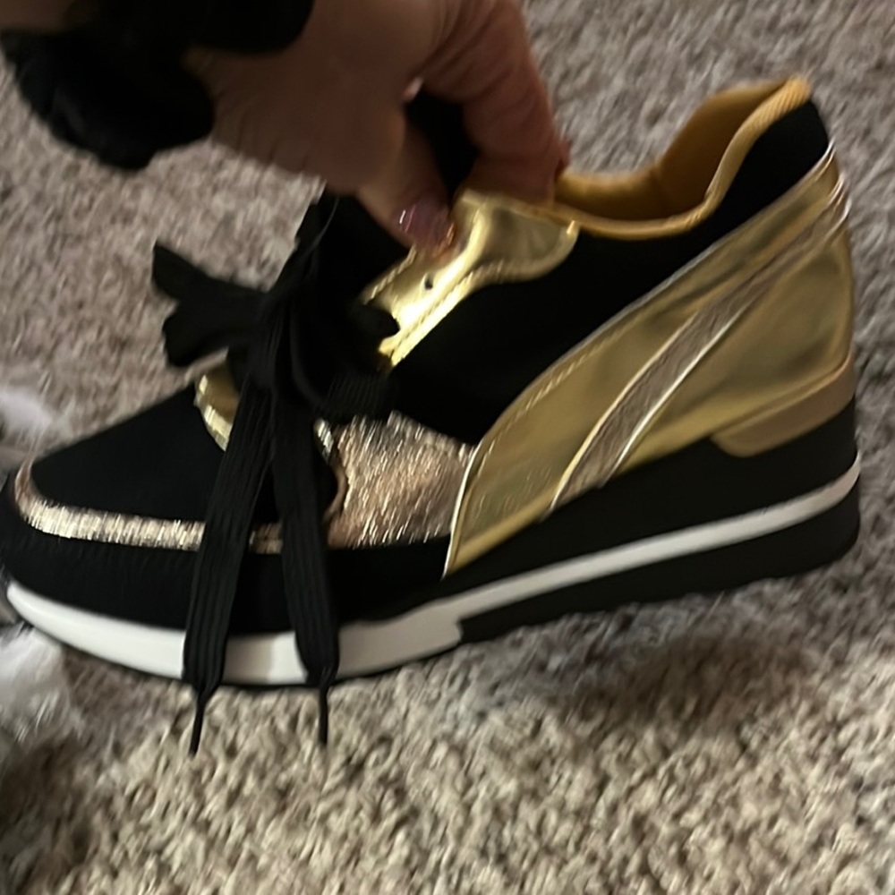 Chic and sporty, Black and Gold Platform Sneakers. Eye catching and fun!